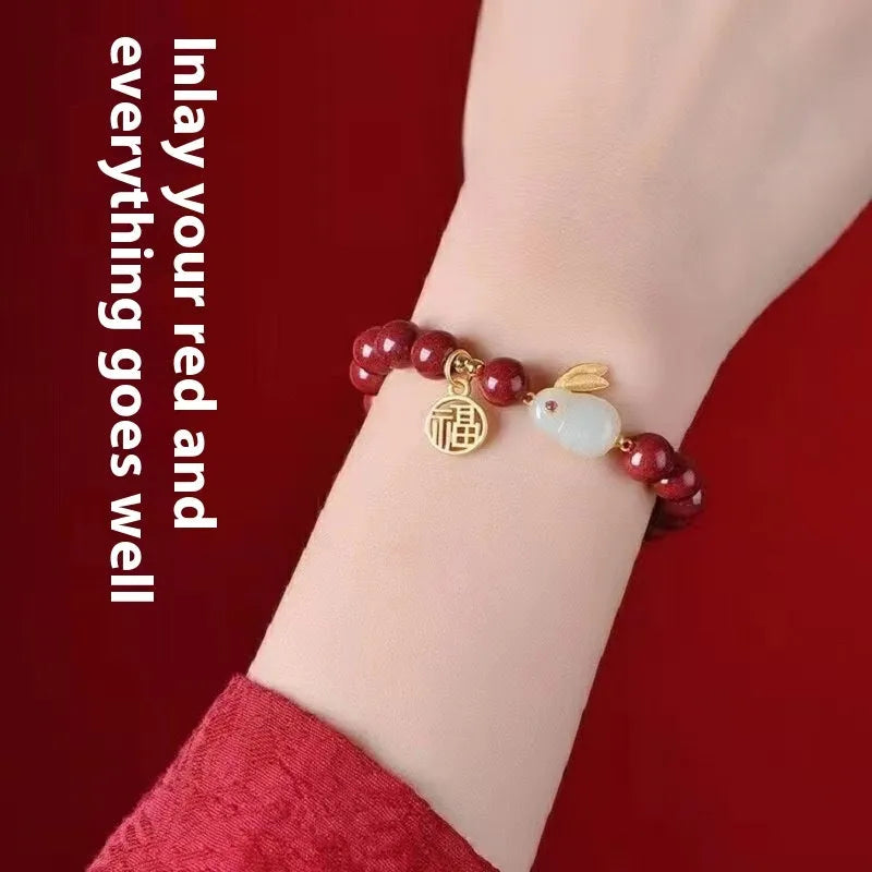 Purple Gold Sand cinnabar bracelet with jade hare charm, shown in 6mm and 8mm bead sizes.