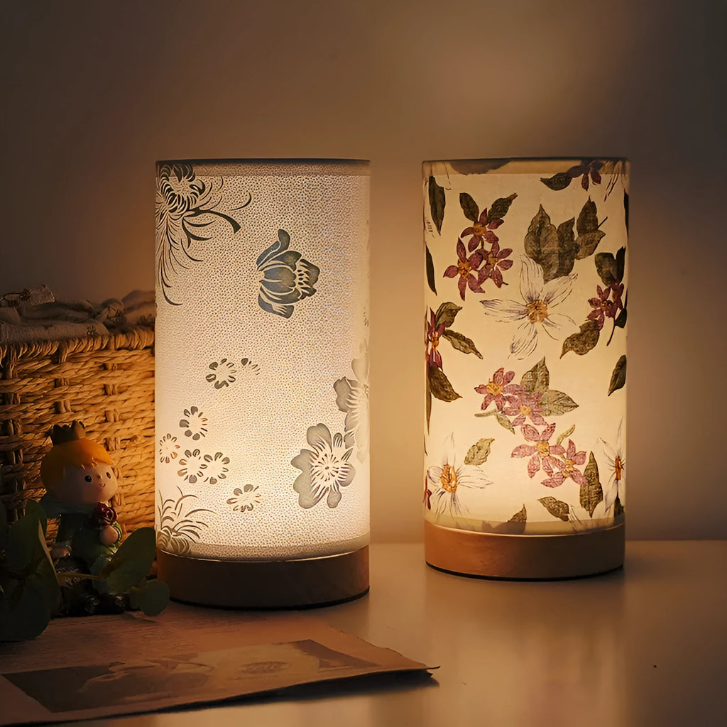Creative USB table lamp with fabric shade in blue butterfly pattern on modern desk