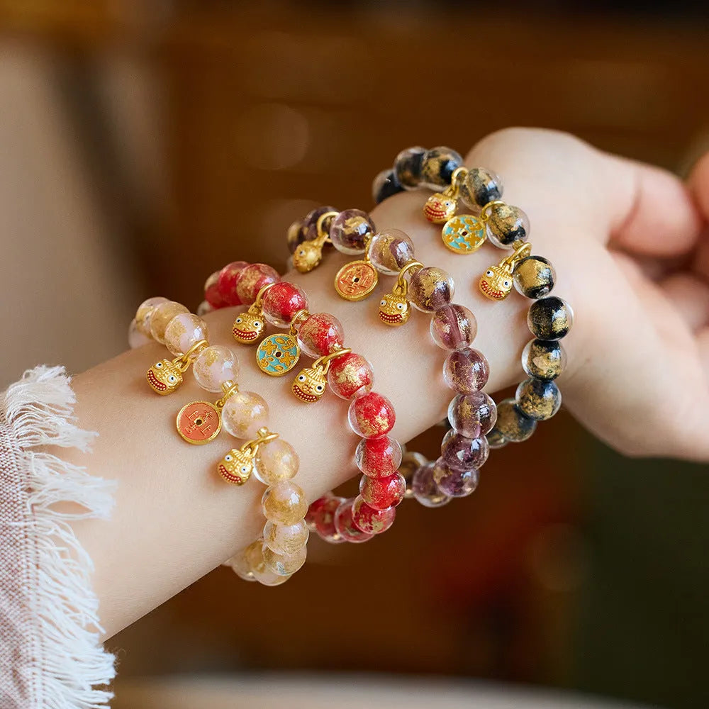 Handmade national style glass coloured glaze swallowing gold beast bracelet in fragrant grey with gold foil accents