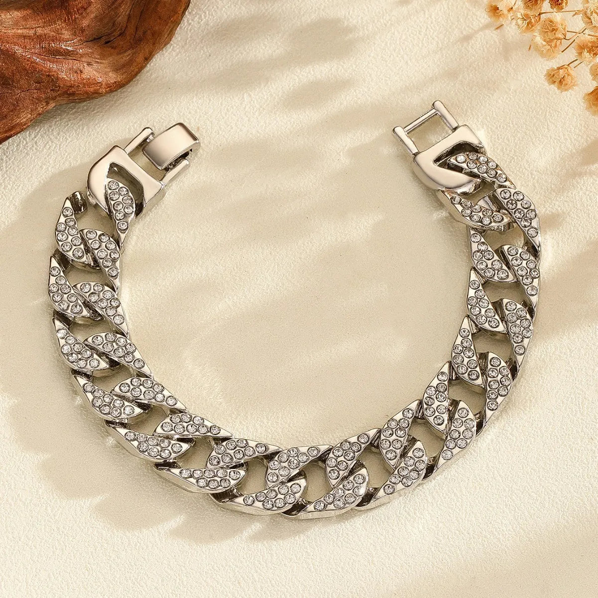 Full diamond heavy metal rap bracelet in gold with chunky link construction and diamond cut surface.