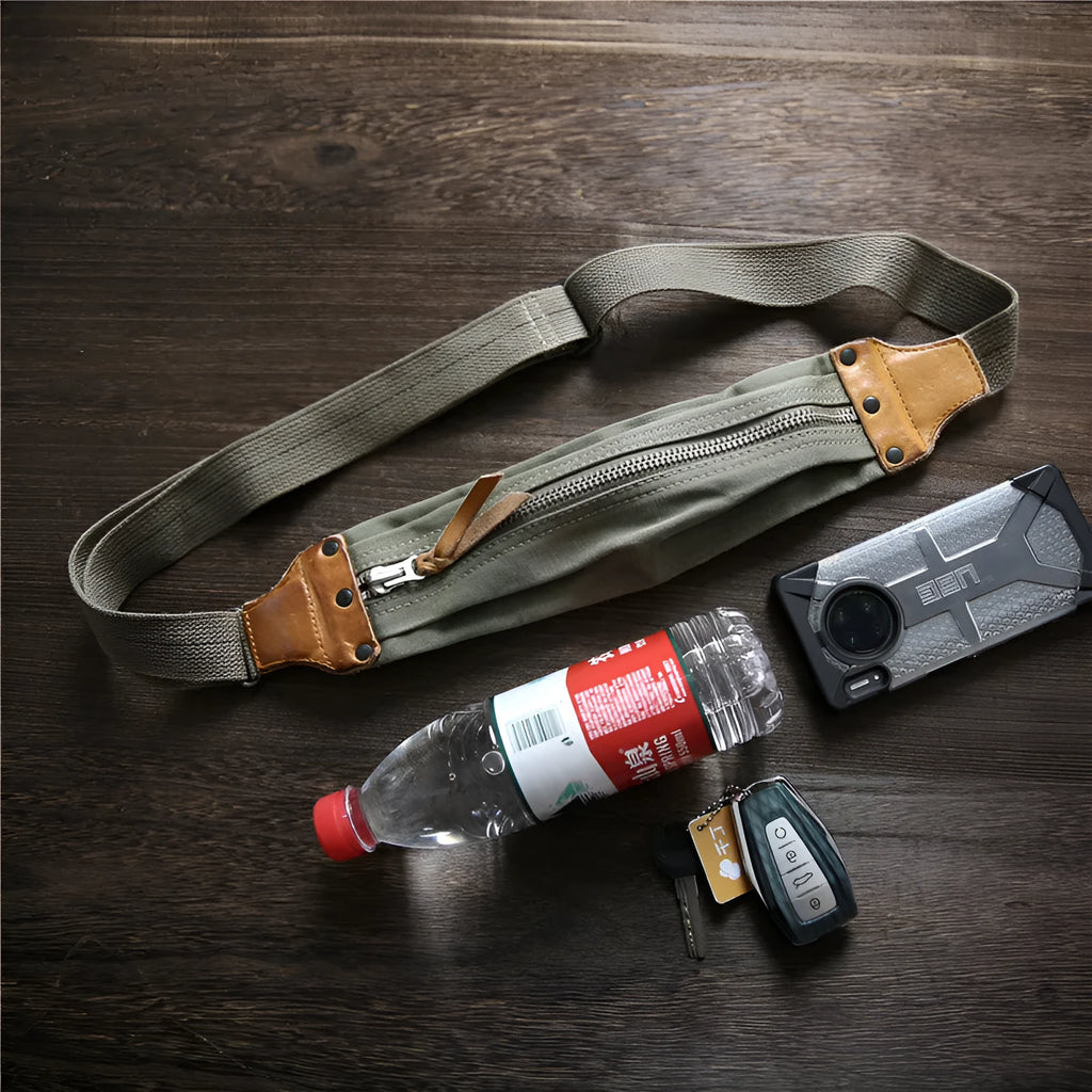 Green American retro military-style chest bag made of washed canvas with Italian leather accents
