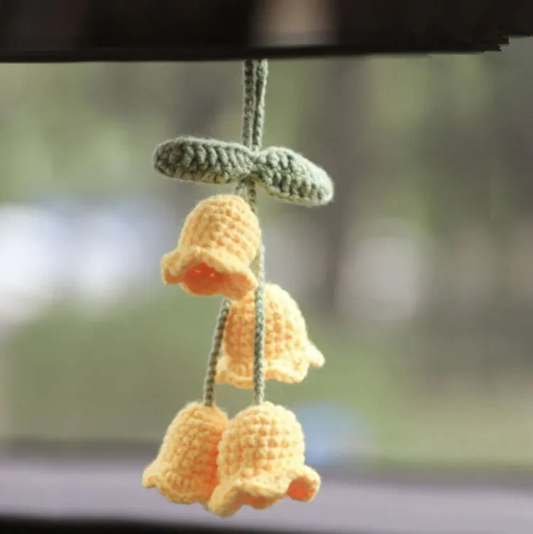 Green and white knitted wool car plant decoration with 8cm base and hanging rope.