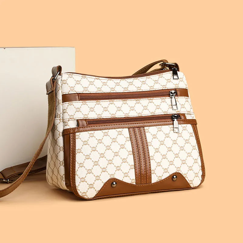 Brown stitching pattern women's crossbody bag made from PU leather with an adjustable strap.