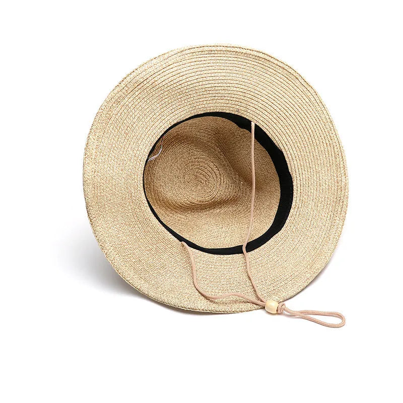 Men's foldable wide-brim straw sun hat in beige, shown on a neutral background.