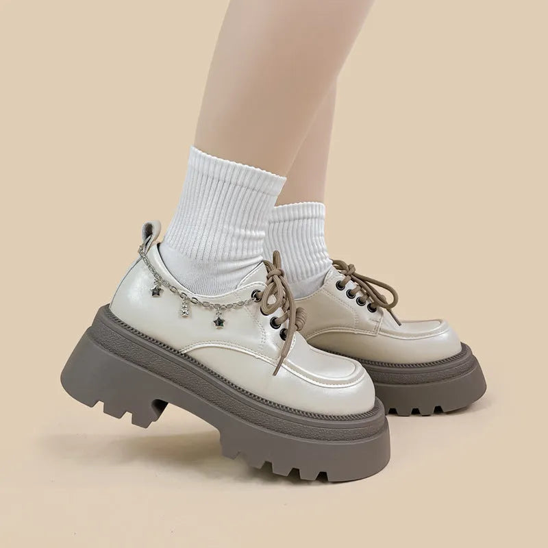 White platform Mary Jane shoes with chunky heel and front lace-up closure
