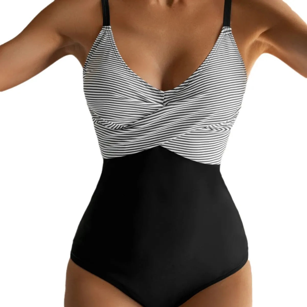 Female model wearing a printed one-piece bikini swimsuit with a lace-up backless design.