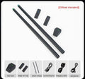 Black somatosensory air drum kit main unit with wireless drumsticks and step mat on a grey background.