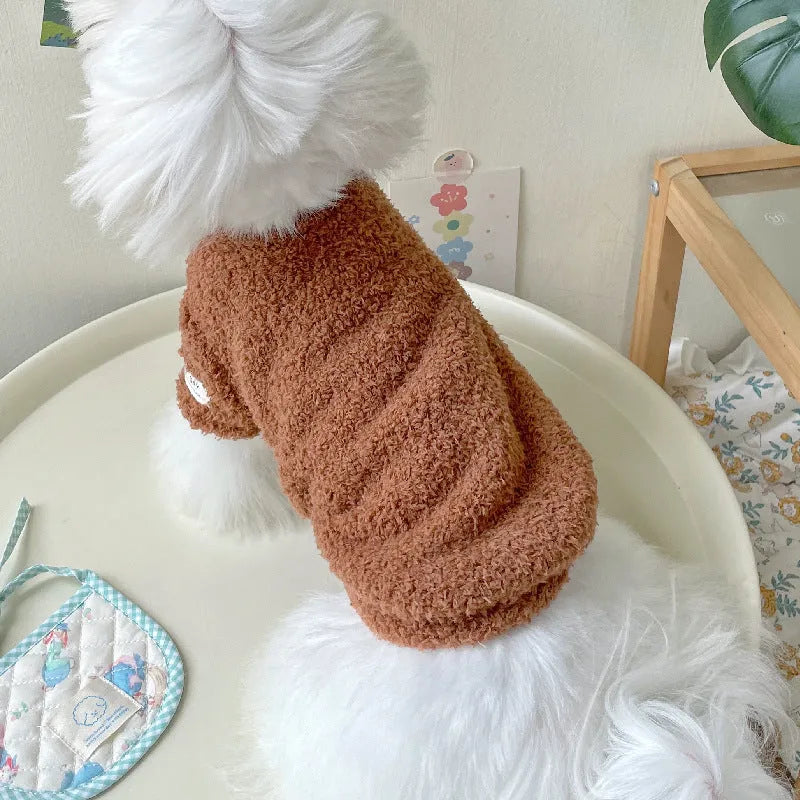 A dog wearing a double-sided cloud velvet thickened jacket in one of six available colours.