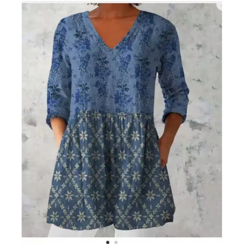 Women's loose-fitting long dress with a blue wave pattern print and 3/4 sleeves.