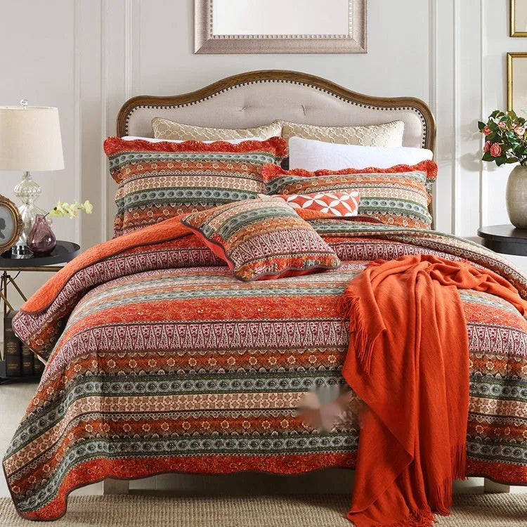 Quilted pure cotton bed cover set with printed pattern, shown with two matching pillowcases on a bed.