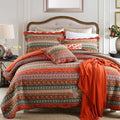 Quilted pure cotton bed cover set with printed pattern, shown with two matching pillowcases on a bed.