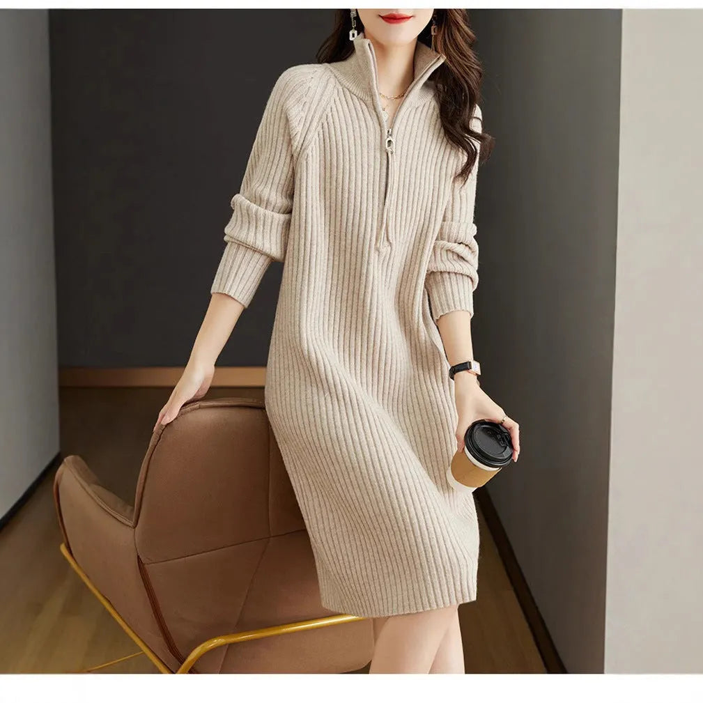 Beige casual women's skirt with half front zipper, stand collar, and long sleeves on a hanger.