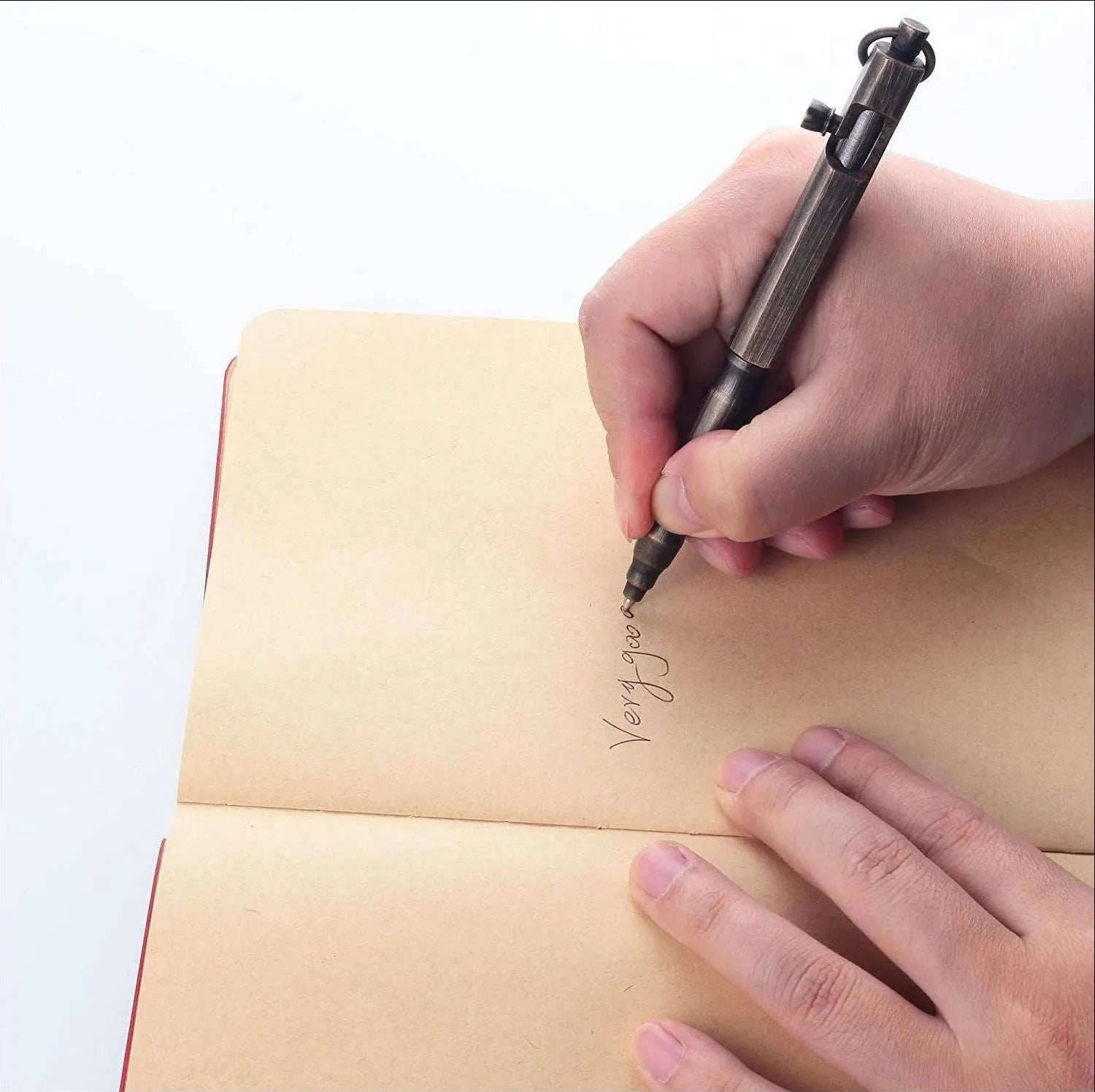 Brass tactical pen with hexagonal bolt pattern showing natural colour finish and precise machining details