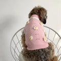 Green flower blossom knitted sweater for a small dog on a white background.
