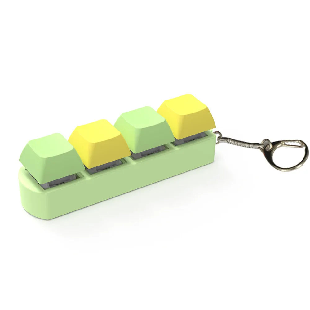 4-key mechanical keyboard switch tester in assorted colours on a desk