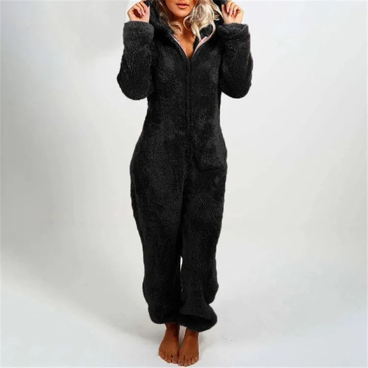 Fleece-lined thickened furry hooded jumpsuit pajama with zipper, loose fit, warm red colour lounging on bed