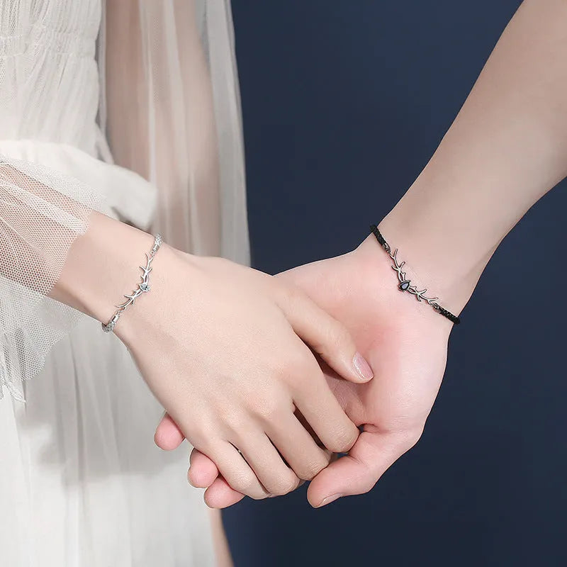 Yi Lu Has You braided rope bracelet in copper with animal zodiac design on display