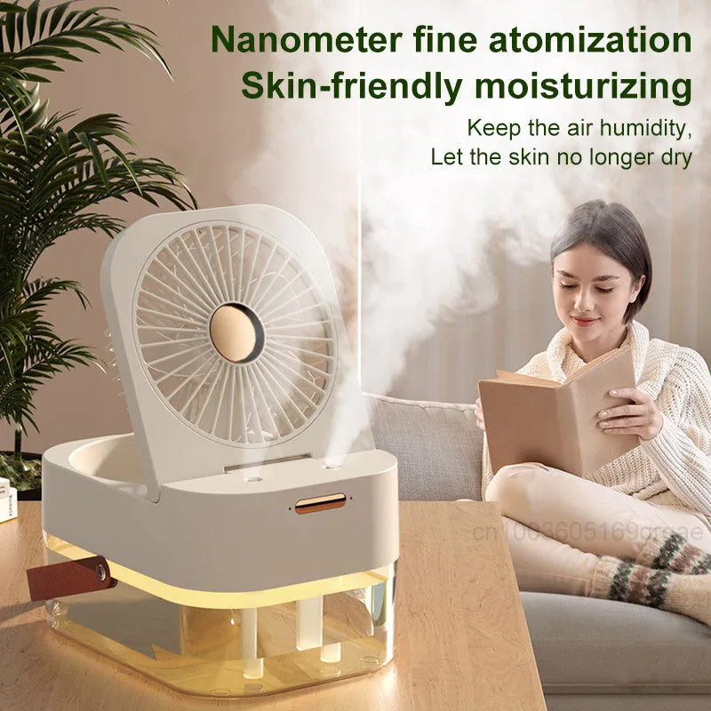 Portable pearl white USB desktop humidifier fan with remote control on a wooden desk.