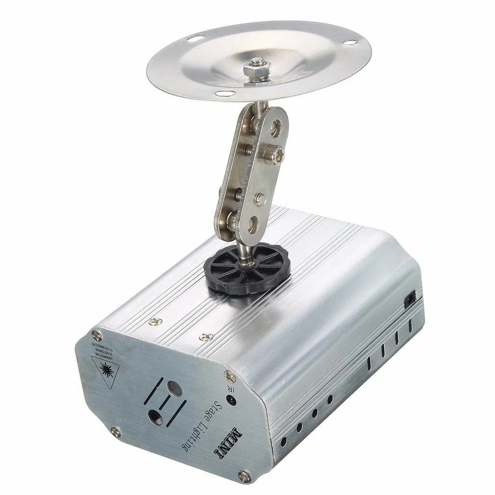 JC-24 dual laser light emitting red and green patterns against a dark indoor background with voice control remote included