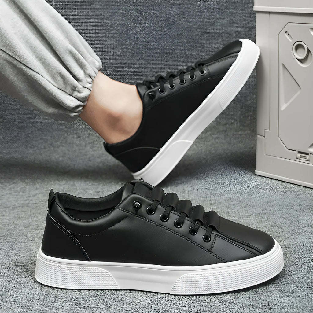 Men's black and white low top sports shoes with synthetic leather upper and PVC sole