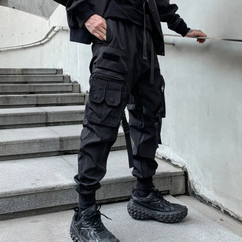 Men's black loose fit casual overalls with elasticated waist and binding hem, front view
