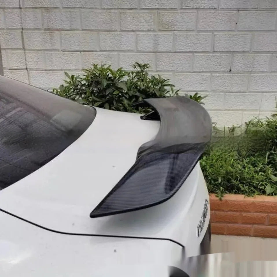 Universal punch-free ABS car spoiler in bright black, carbon, white, and blank finishes.