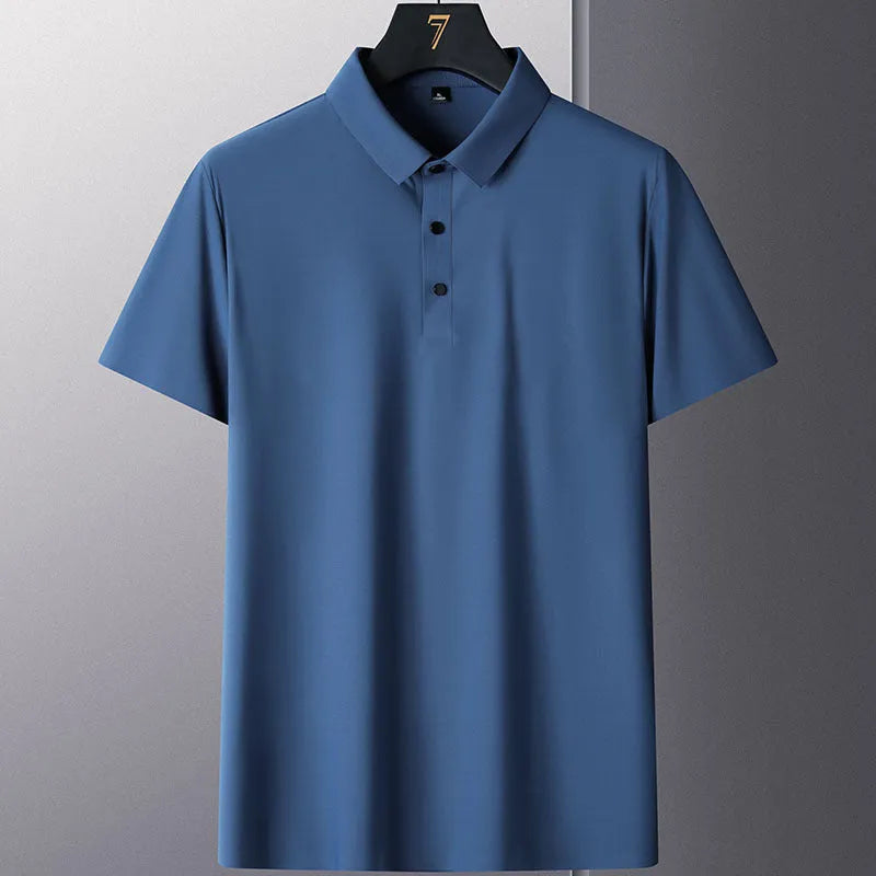 Man wearing a solid colour non-ironing business casual short sleeve shirt in a light blue shade.