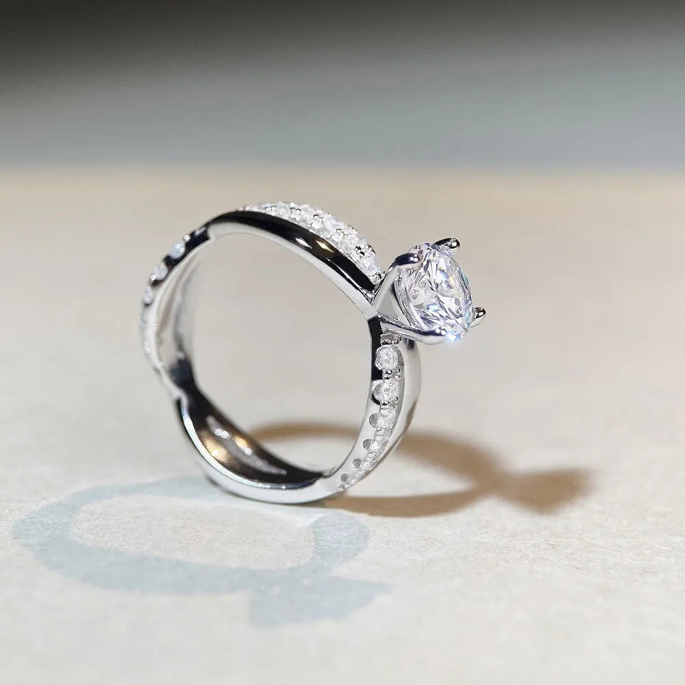 Silver ring with twisted band and 1 carat moissanite stone in four-claw setting