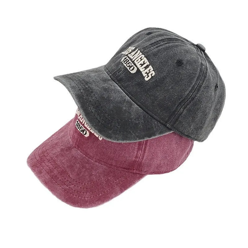 Retro personalised embroidered letters peaked cap in distressed fabric, adjustable fit, shown in beige colour.