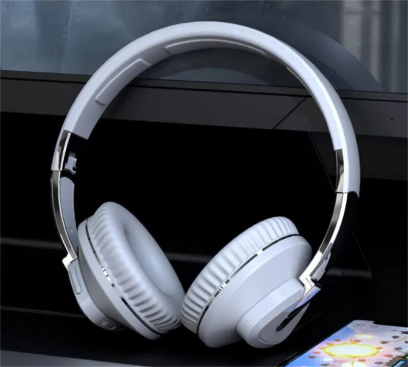 Wireless headset with subwoofer in black, white, blue, or khaki colours showing all-inclusive ear design