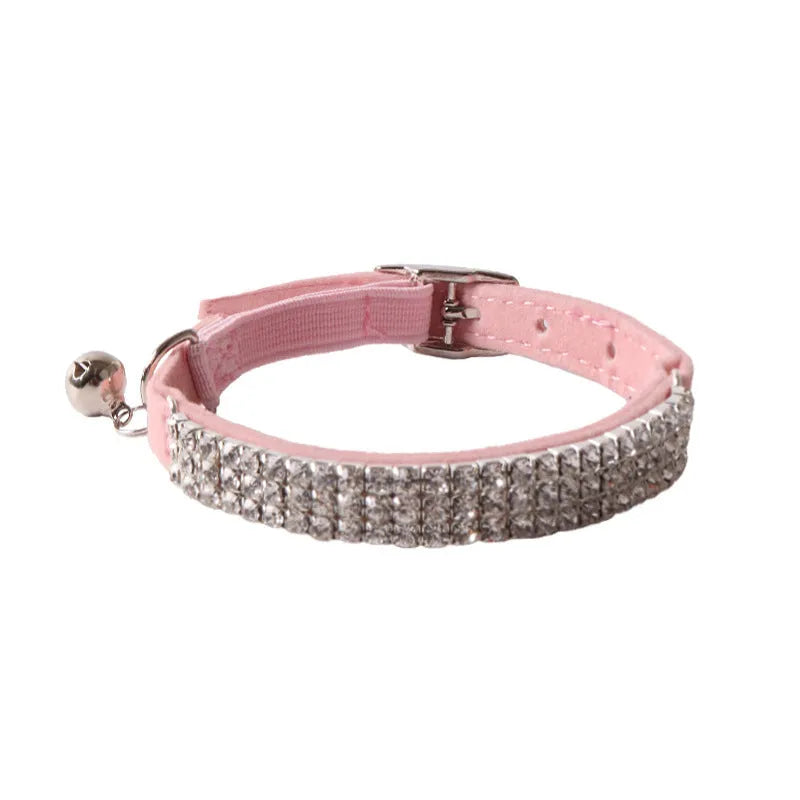 Soft flocked cat collar with an elastic buckle shown in multiple colours.