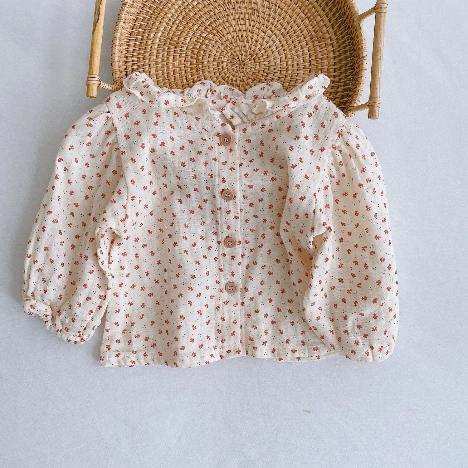 Baby romper climber suit with triangle design and pleated lotus leaf sling in cotton fabric