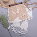 Women's lace-up front split swimsuit in cotton blend fabric on a beach background.