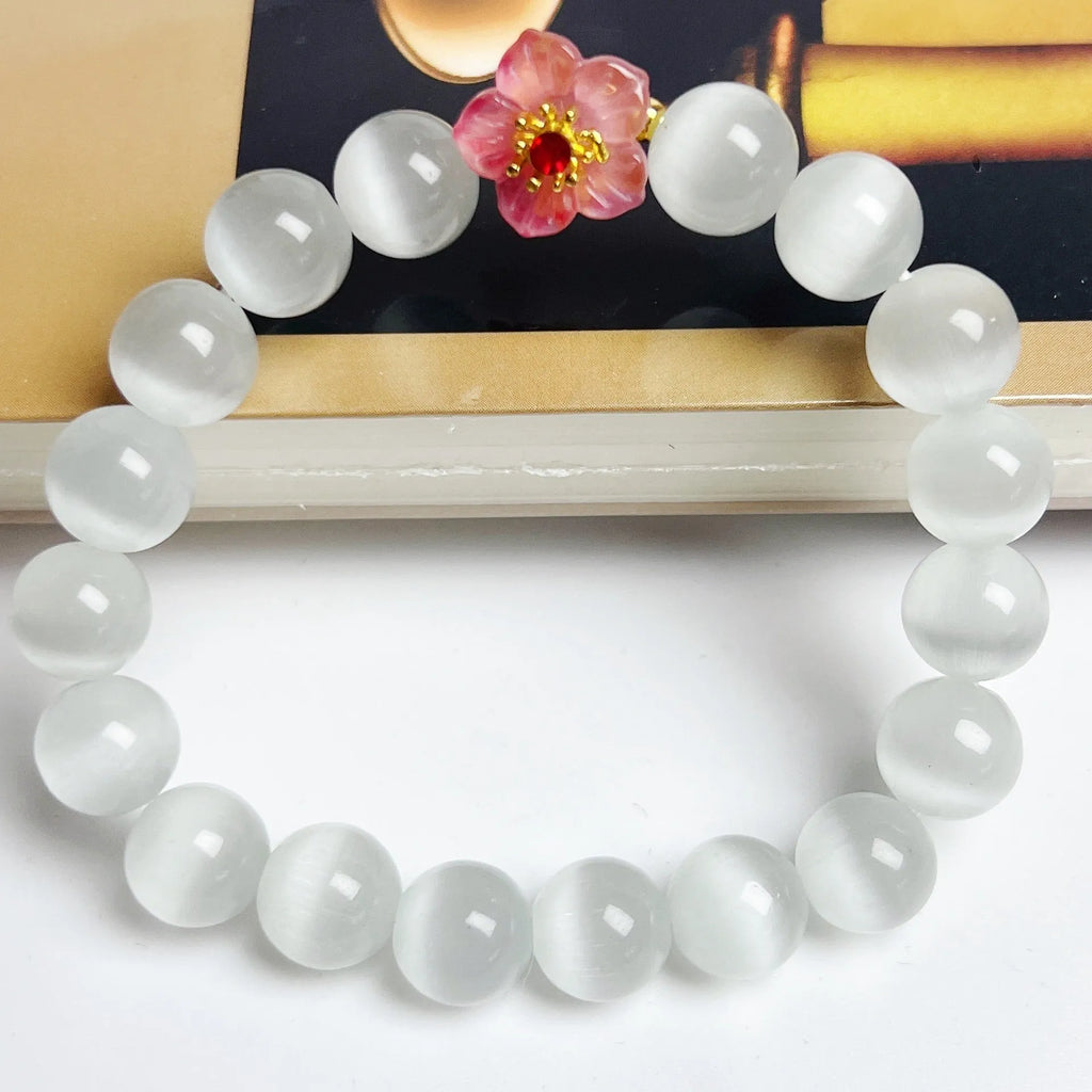 Handmade women's glass beaded bracelet with flower elements in multiple colour options