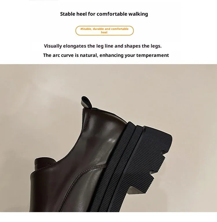 Women's black chunky square heel shoes with cross strap and round toe on a neutral background