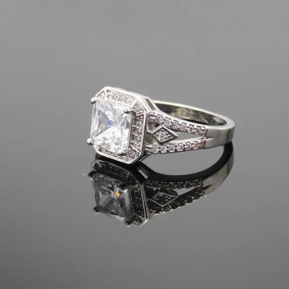 Women's geometric ring with hollow design and inlaid zircon stone in platinum colour.
