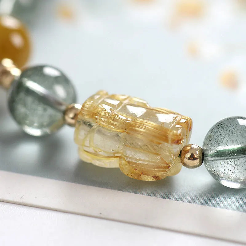 Green phantom quartz crystal bracelet with gold rutile needles and 8mm geometric beads