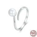 S925 sterling silver adjustable open loop ring with a natural shell pearl on a white background.