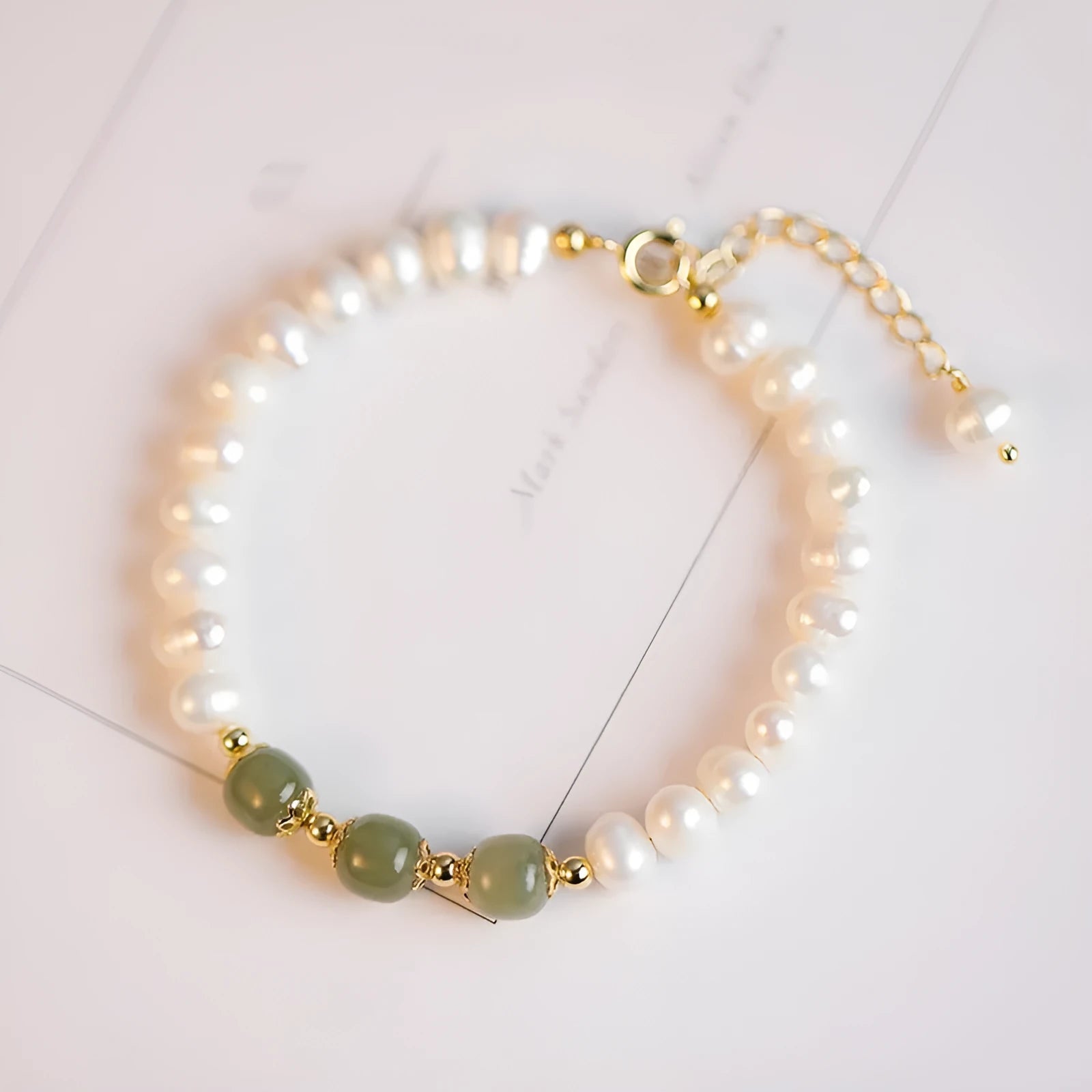 Freshwater pearl bracelet with diamond-shaped pearls in Hetian jade colour on an adjustable chain.