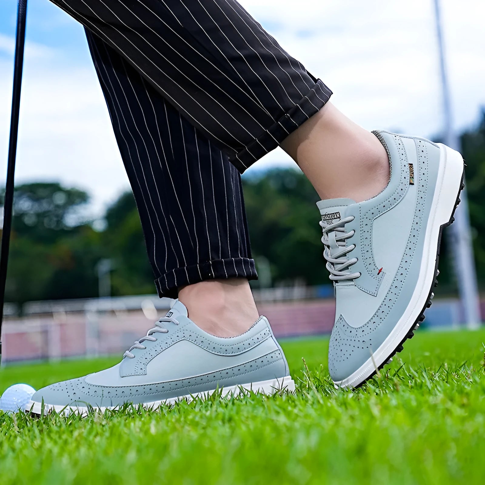 Men's genuine leather golf shoe with rubber sole in lake blue or white.