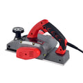 Red desktop electric wood planer with aluminium body showing 82mm planing width