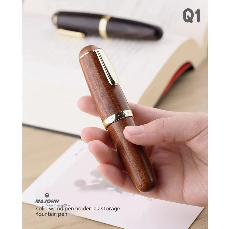 Solid wood short chubby ink pen with fine tip on wooden surface