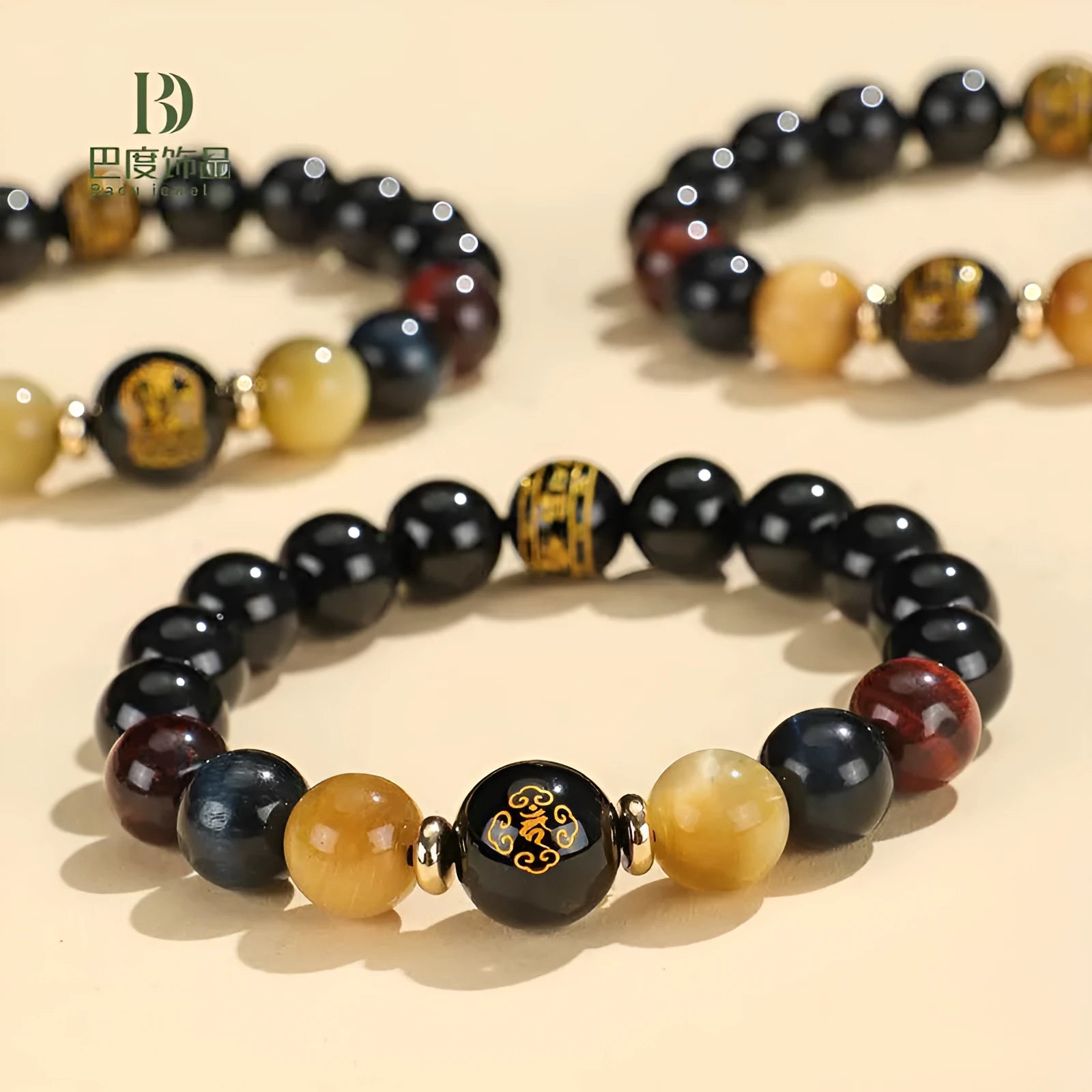 Handmade black agate bracelet with zodiac animal charms and gold tiger eye beads on wrist