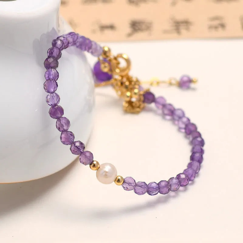 Women's amethyst crystal bracelet with diamond-shaped Chinese style design and secure clasp