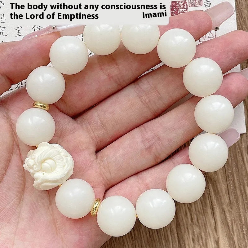 Handcrafted Xingshi obsidian prayer bead bracelet with chamfered square grain design, shown in 12mm size.