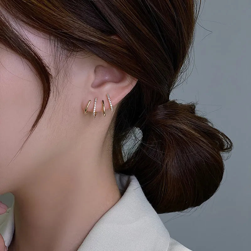 Pair of S925 silver needle four-prong zircon inlaid geometric stud earrings in gold finish