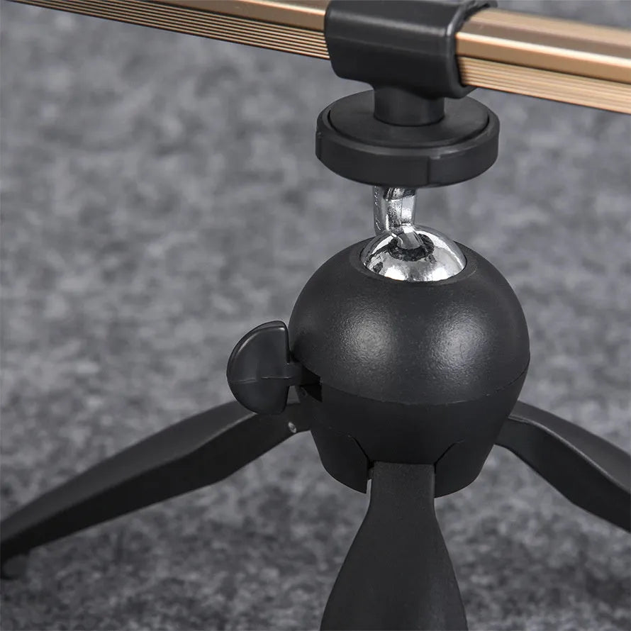 Aluminium alloy ice fishing tripod rod holder bracket standing on ice.