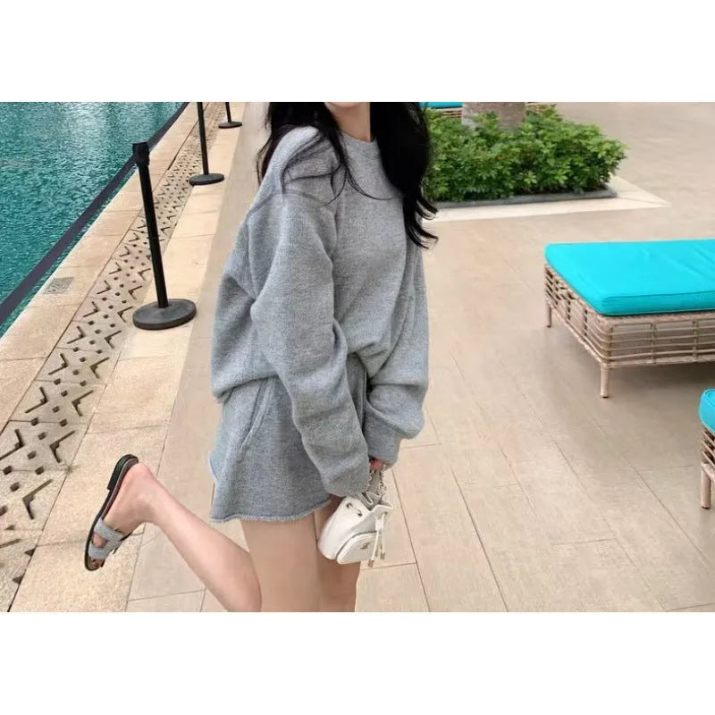 Women's loose-fit long sleeve sweater and knitted wide-leg shorts two-piece set in oatmeal colour.