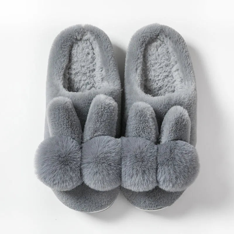 Women's high-top rabbit fur winter slippers in various colours on a neutral background