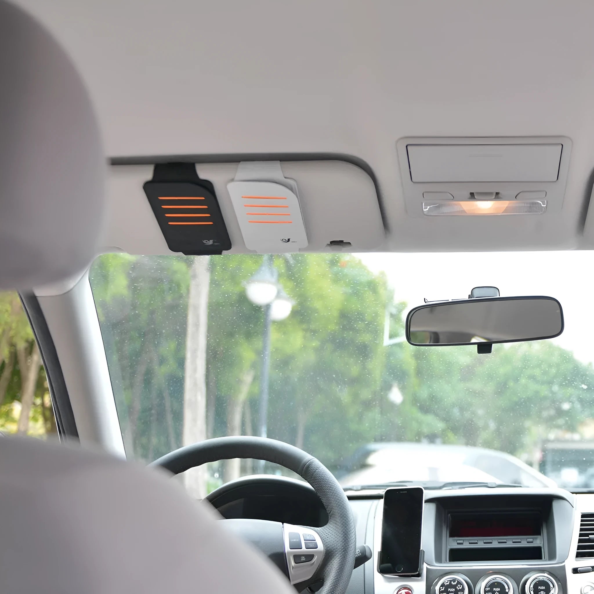 Car accessory package containing a vehicle-mounted bag and four sun visor panels for the windscreen.